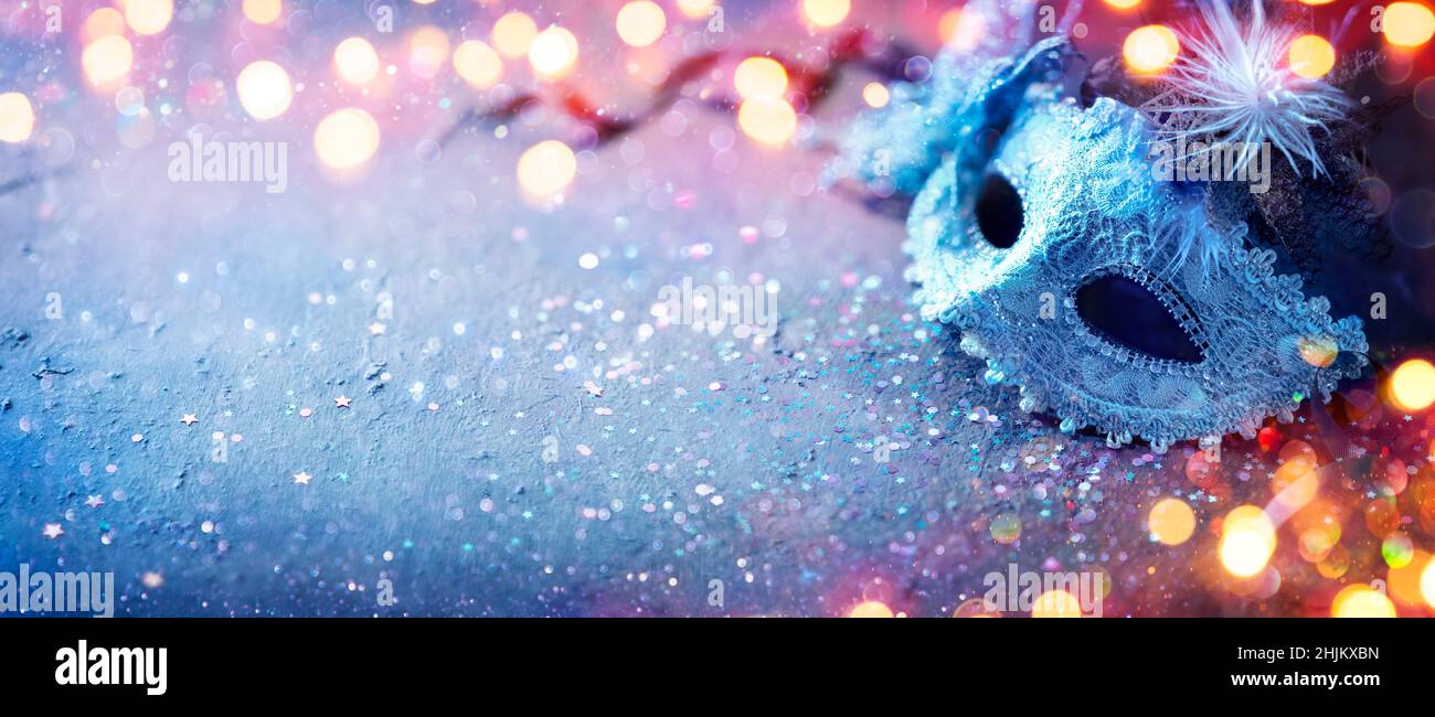 Carnival Mask - Party Masquerade With Abstract Defocused Bokeh Lights On Shiny Confetti Stock Photo