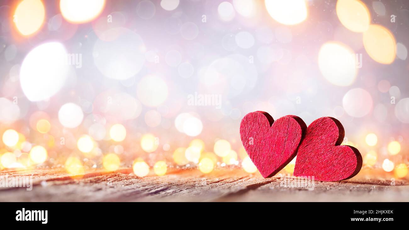 Valentine's Day - Wooden Hearts With Defocused Blurred Lights Stock Photo