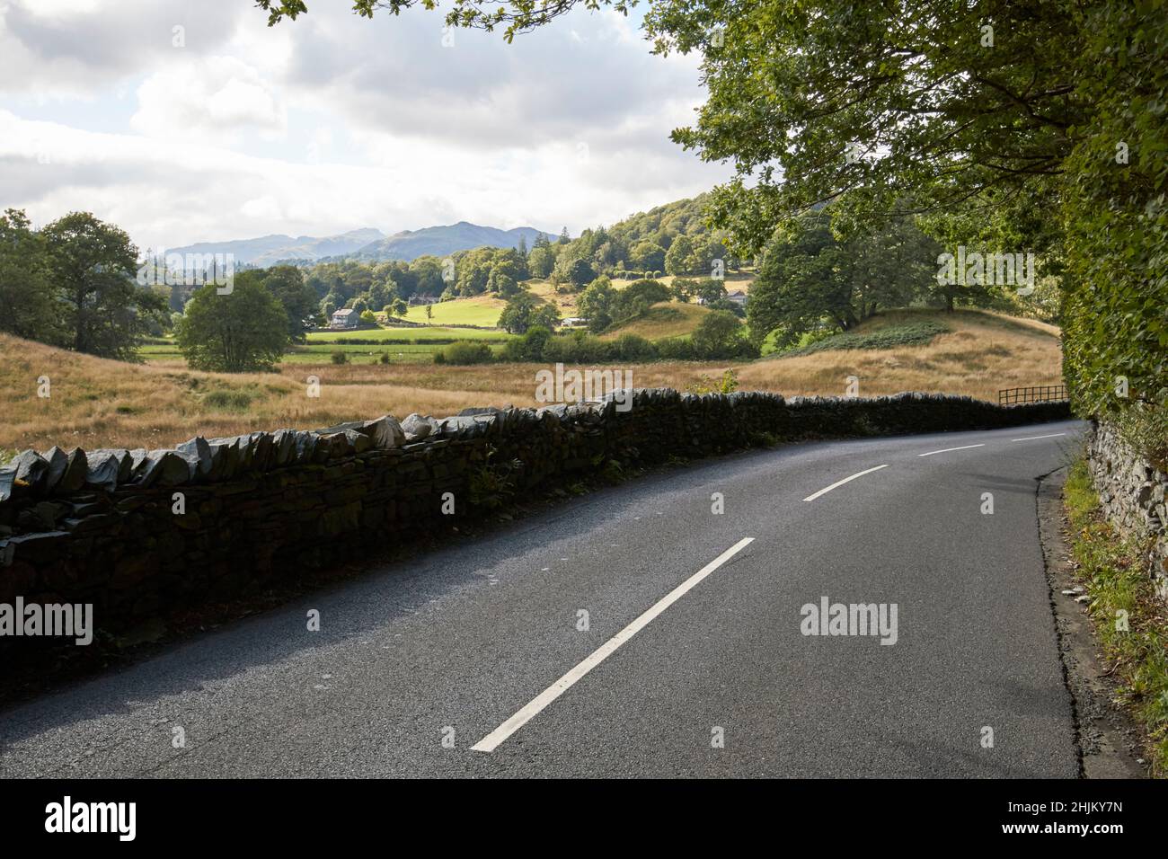 empty a593 road between ambleside and skelwith bridge looking towards skelwith lake district, cumbria, england, uk Stock Photo