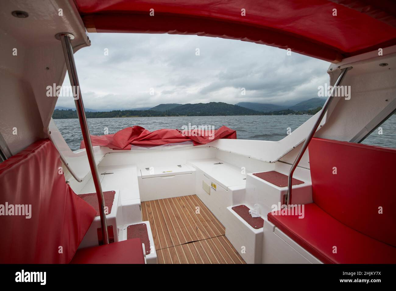 looking out of the rear on a small boat out on lake windermere lake district, cumbria, england, uk Stock Photo