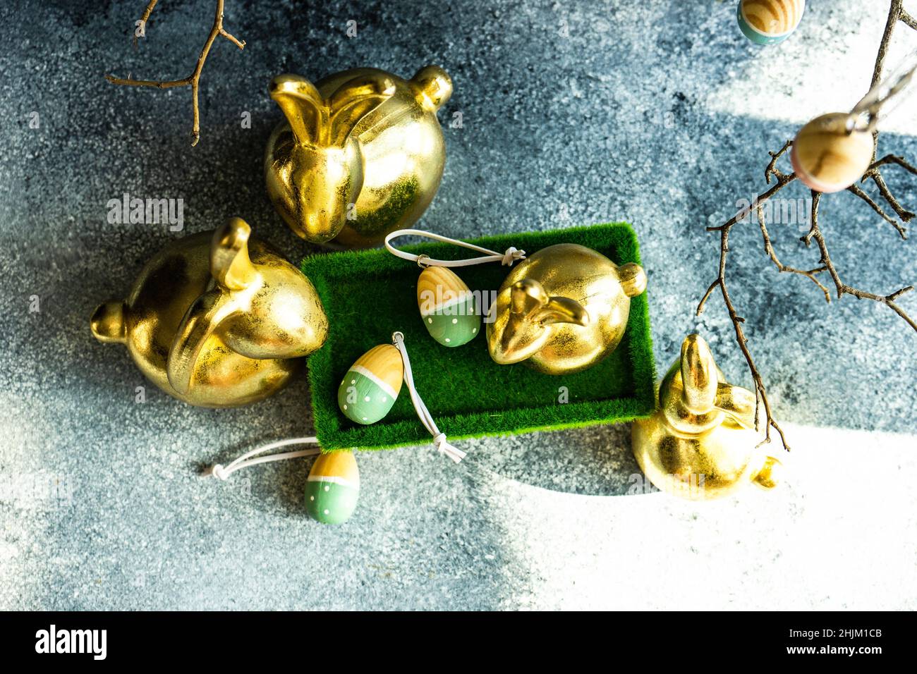 Place setting for festive Easter dinner using with golden bunnies Stock Photo