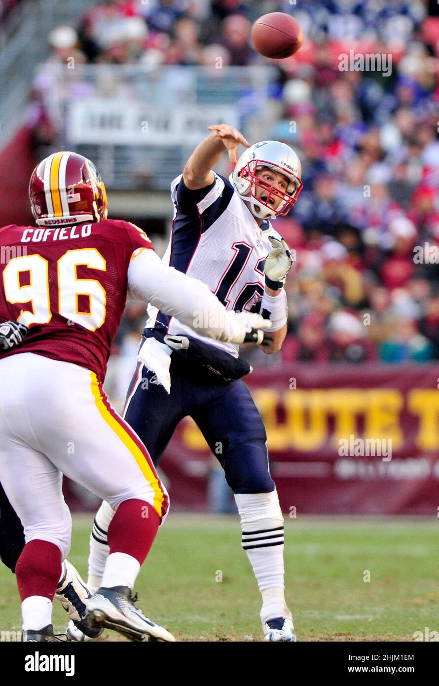 New England Patriots quarterback Tom Brady (12) passes over Washington  Redskins nose tackle Barry Cofield (96) in fourth quarter action at FedEx  Field in Landover, Maryland on Sunday December 11, 2011. The