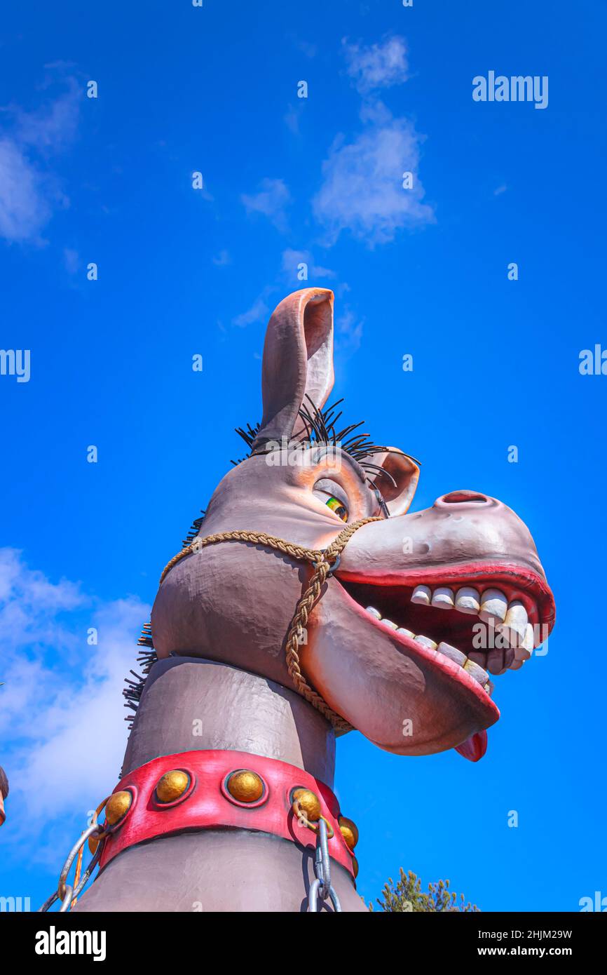 Putignano, Apulia, Italy - February 15, 2015: carnival floats, giant paper mache. Allegorical float: laughing donkey. Stock Photo