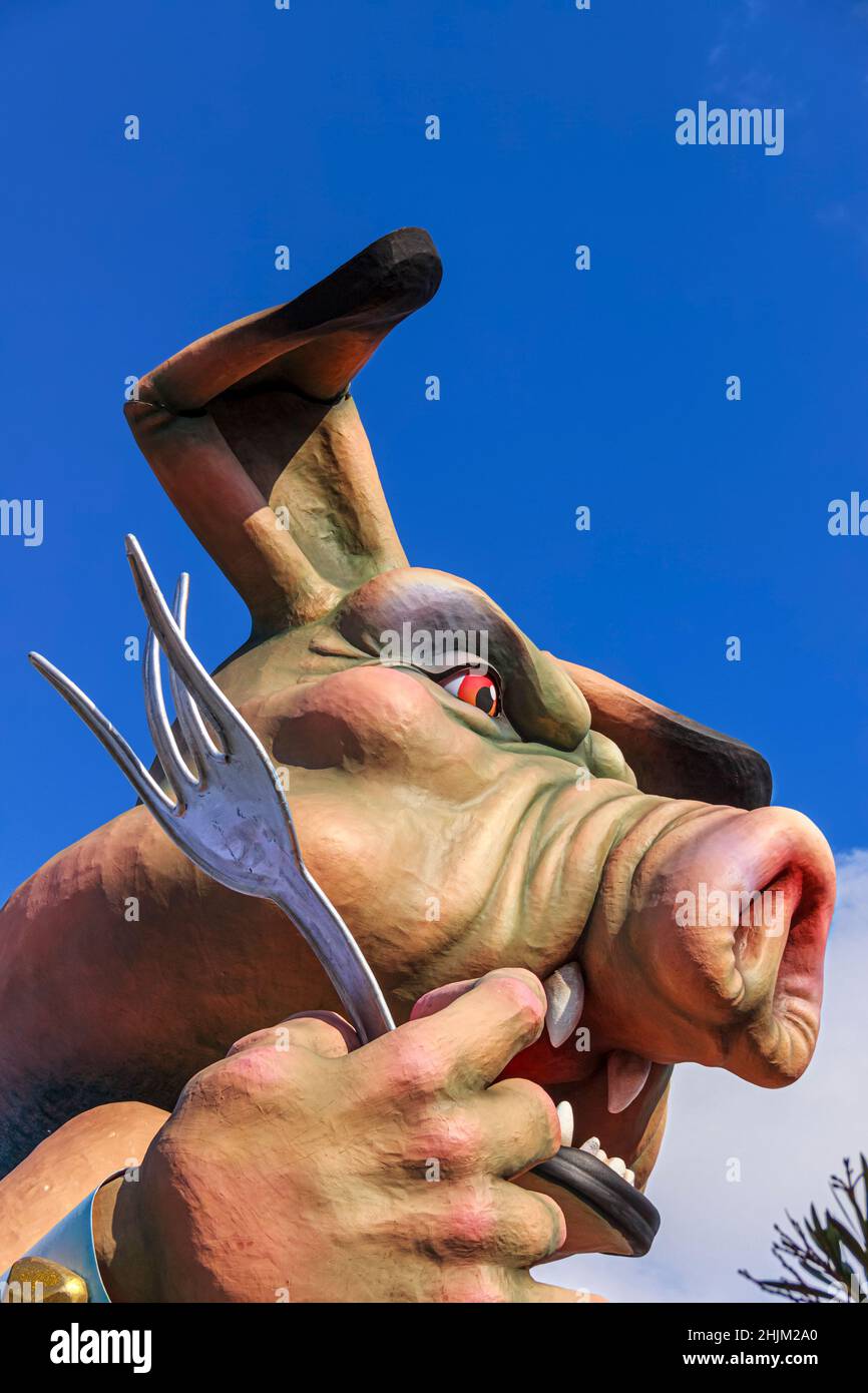 Putignano, Apulia, Italy - February 15, 2015: carnival floats, giant paper mache. Allegorical float:pig with forks. Stock Photo