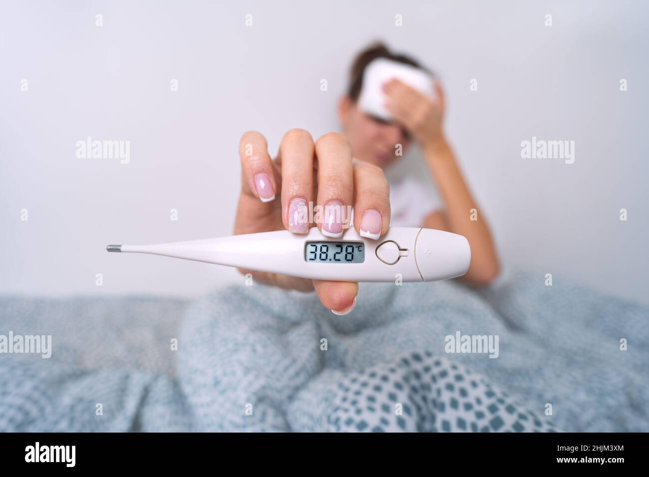 https://c8.alamy.com/comp/2HJM3XM/sick-woman-with-a-high-fever-showing-medical-thermometer-with-temperature-382-woman-measuring-body-temperature-2HJM3XM.jpg