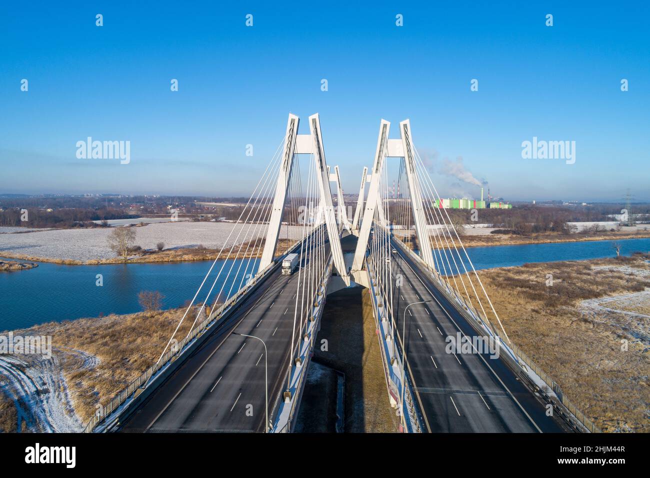 New modern Macharski double cable-stayed three-lane suspension bridge over Vistula River in Krakow, Poland. Aerial view in winter. Part of the ring ro Stock Photo