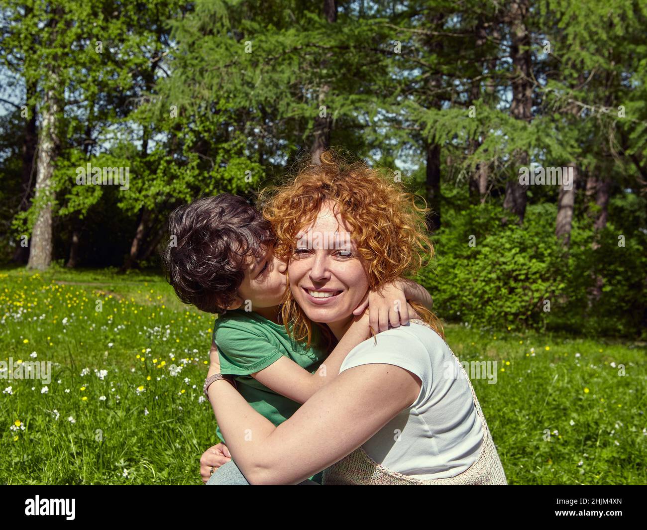 Mother and her son hug tightly Stock Photo Alamy