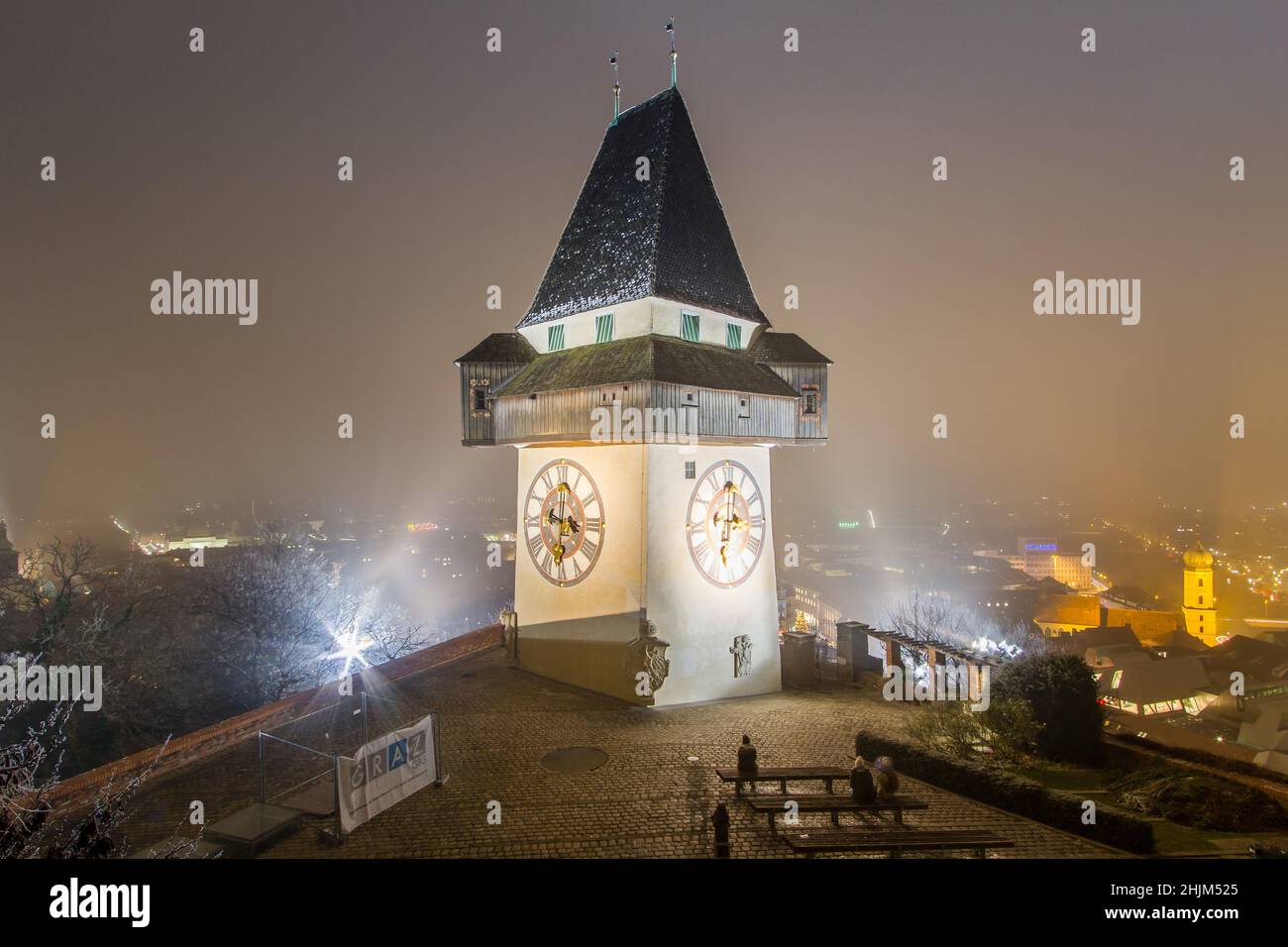 The Uhrturm, the landmark of Graz, at night Stock Photo