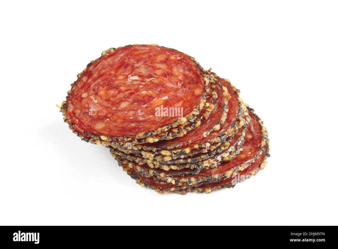 Stack of sliced cured meat isolated on white background.Dry smoked beef