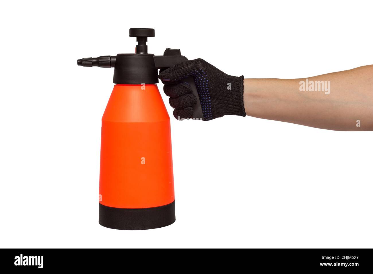 A mans hand holds hand-pumped sprayer isolated on white background. Garden pressure sprayer for dispensing fertilizer, pesticide or herbicide. Garden Stock Photo