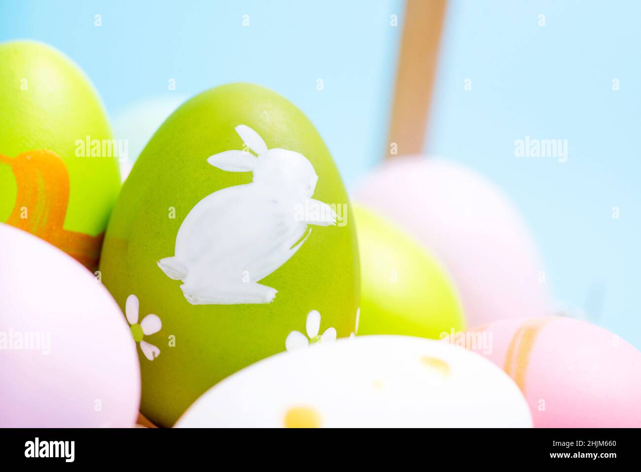 Easter Eggs. Easter eggs in basket. Colorful easter eggs background. Stock Photo
