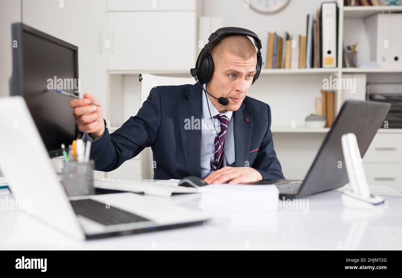 Portrait of friendly man call center operator Stock Photo - Alamy