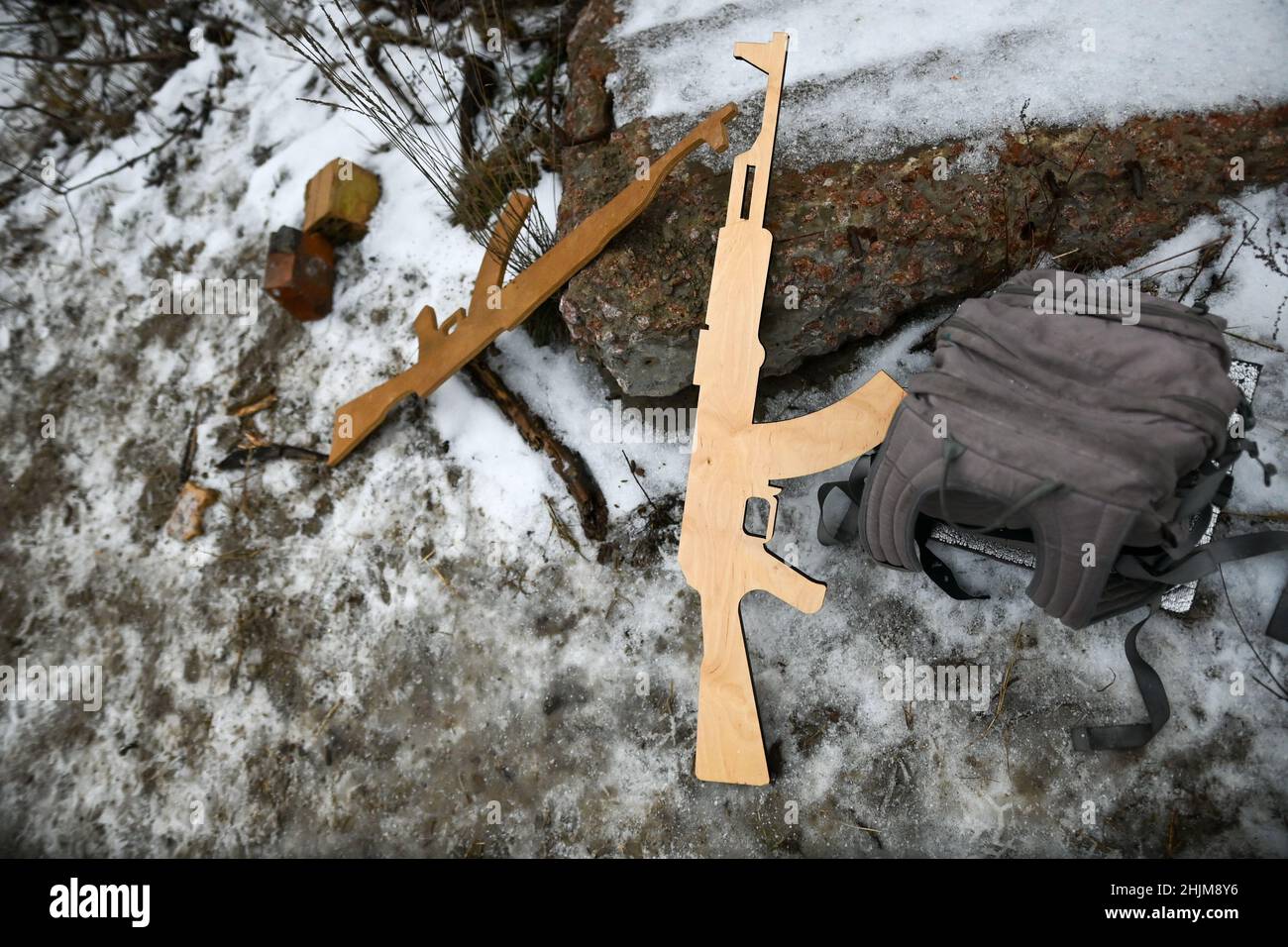 Ukraine. 29th Jan, 2022. Fake wooden rifles are stacked on a log during a break in the military training. Ukrainian civilians and reservists conduct military training in the outskirts of Kyiv under the Ukrainian Territorial Defense Forces as Russian troops mass on the nation's borders. Kyiv Ukraine, 01/29/2022. (Photo by Justin Yau/Sipa USA) Credit: Sipa USA/Alamy Live News Stock Photo