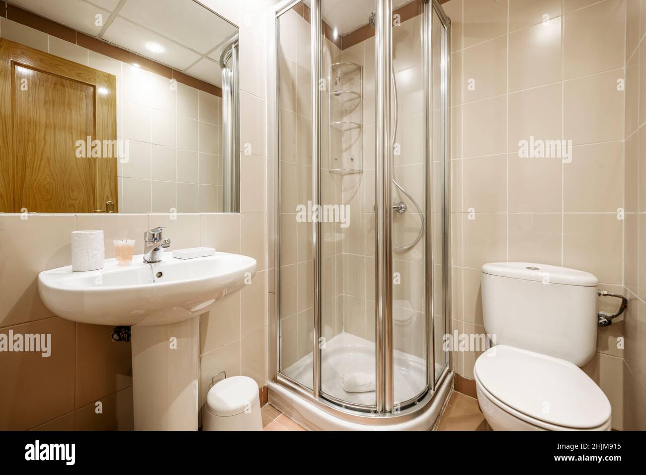 Bathroom with porcelain pedestal sink and recessed rectangular mirror ...