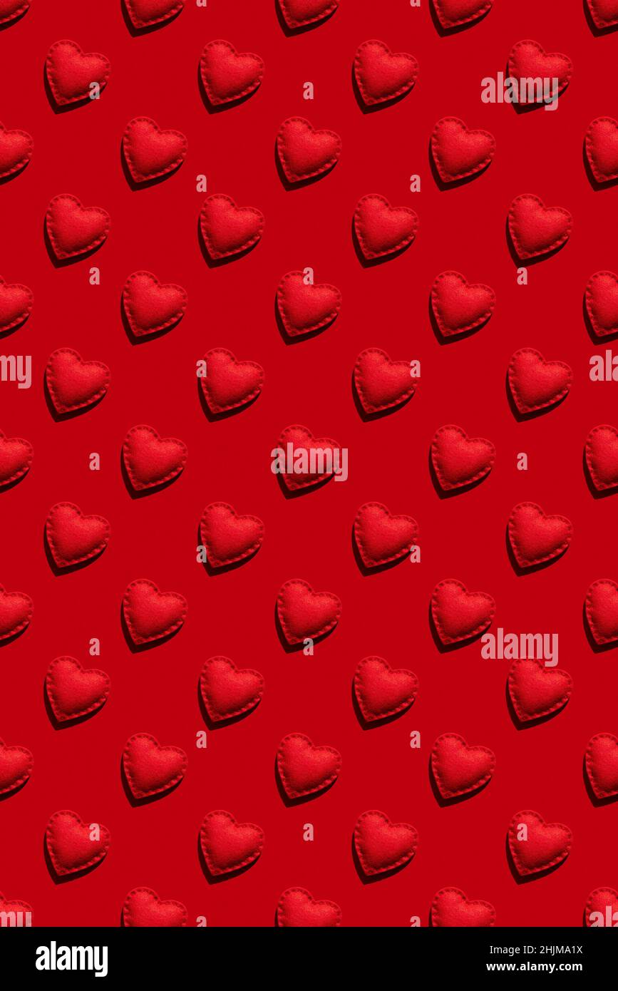 Red background with seamless pattern of hearts for Valentine's day Stock Photo