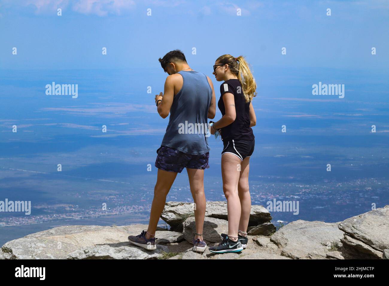 SAN LUIS, 25.01.2022: Tourists have fun in the different attractions offered by the large mountains in Merlo, San Luis, Argentina Stock Photo