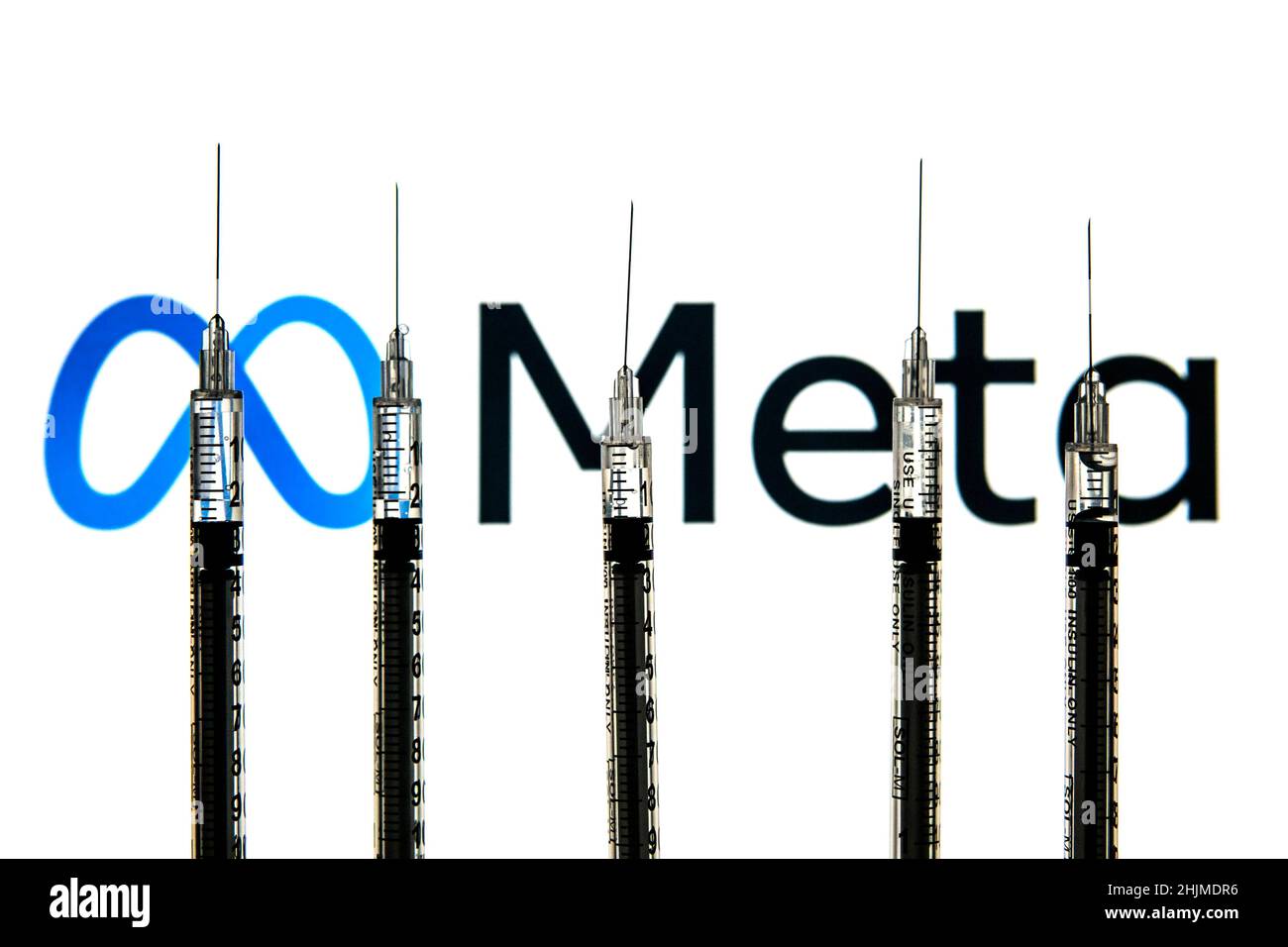 Spain. 24th Jan, 2022. In this photo illustration medical syringes seen with a Meta logo in the background. (Credit Image: © Thiago Prudencio/SOPA Images via ZUMA Press Wire) Stock Photo