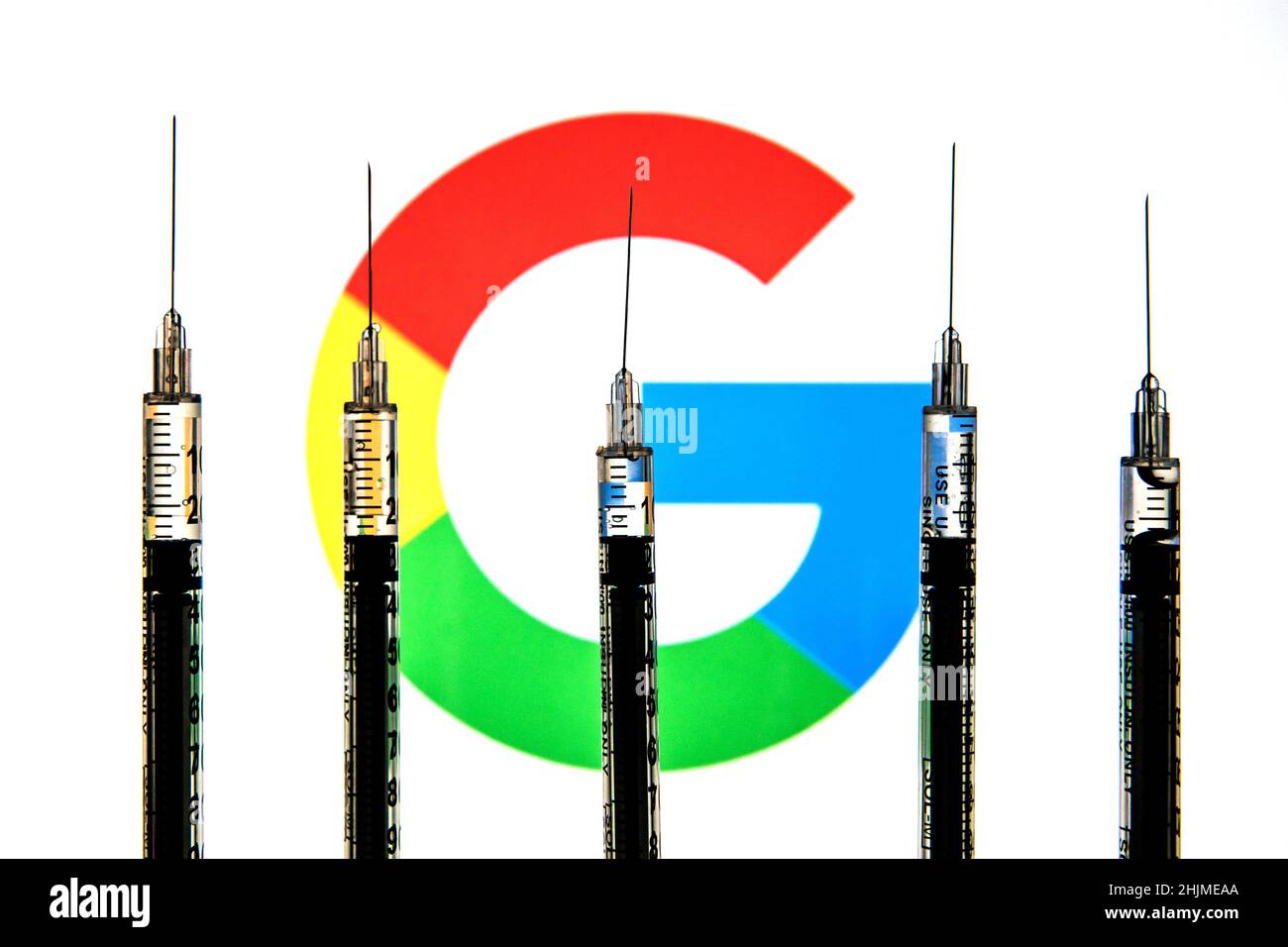 Spain. 24th Jan, 2022. In this photo illustration medical syringes seen with a Google logo in the background. (Credit Image: © Thiago Prudencio/SOPA Images via ZUMA Press Wire) Stock Photo