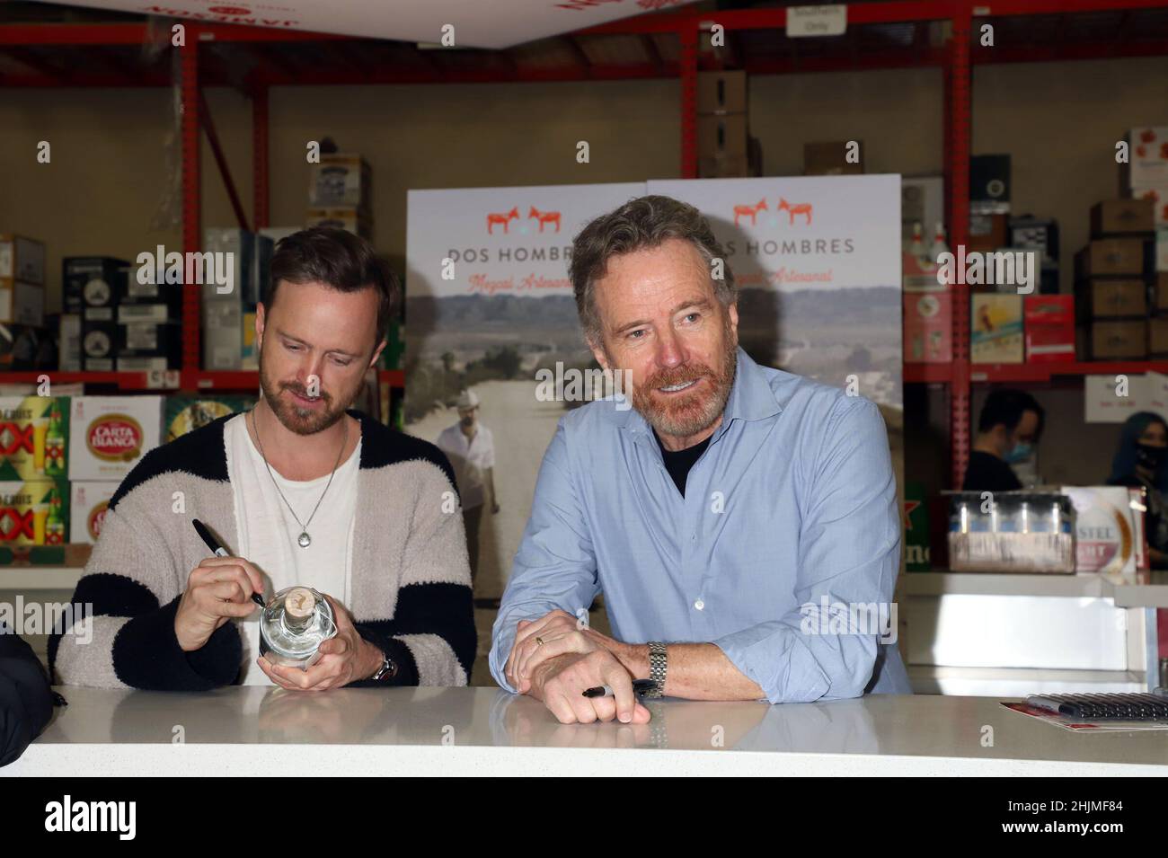 Las Vegas, Nevada, USA. 30th Jan, 2022. Aaron Paul, Bryan Cranston Breaking Bad Stars BRYAN CRANSTON and AARON PAUL Sign Bottles of 'Dos Hombres Mezcal' At In Person Bottle Signing Lee's Discount Liquor  Las Vegas, Nv  January 30, 2022 Credit: ENT/Alamy Live News Stock Photo