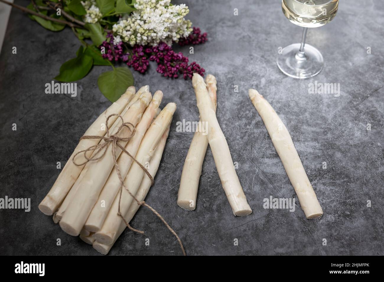 Bunch of fresh white asparagus on a stone table Stock Photo