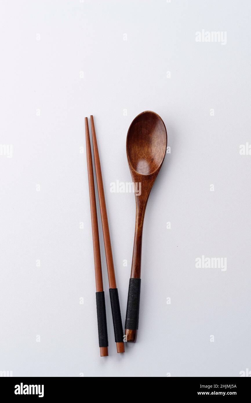 Korean Spoon and Chopstick Wooden Cutlery Isolated on White Table, Copy Space, Eat Concept Stock Photo