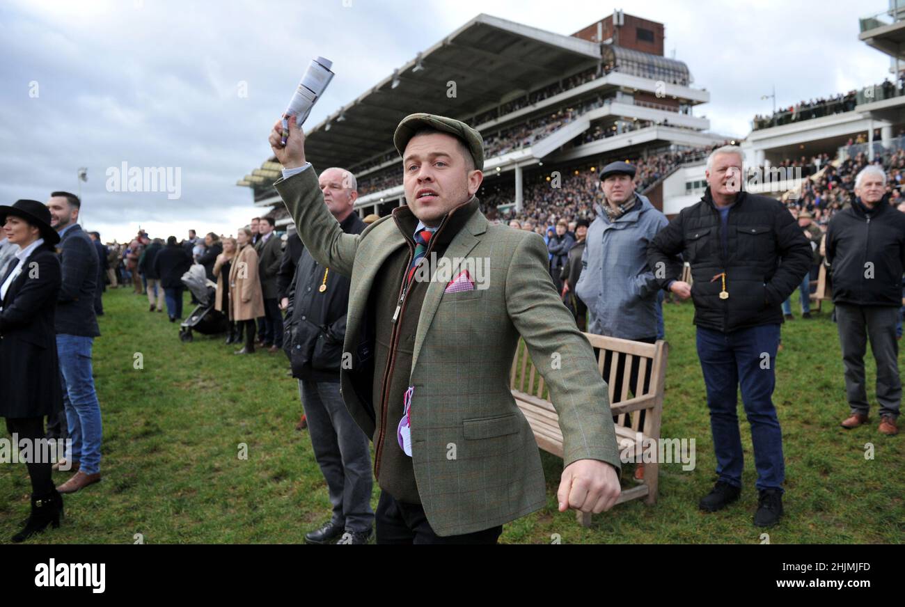 Racing at Cheltenham Racecourse, Prestbury Park on Festival Trials Day in January ahead of the Cheltenham Gold Cup Festival in March.   Crowds watchin Stock Photo