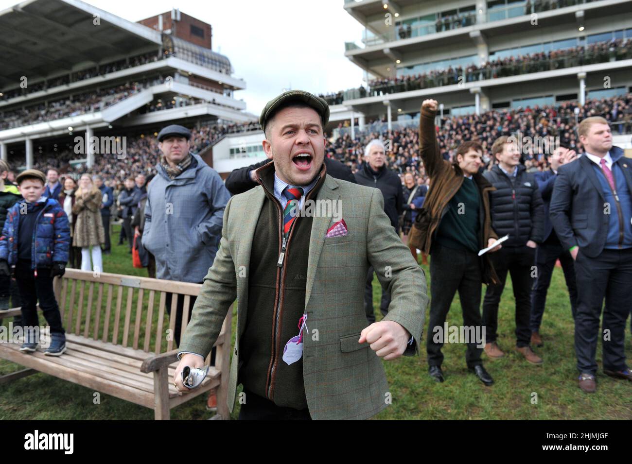 Racing at Cheltenham Racecourse, Prestbury Park on Festival Trials Day in January ahead of the Cheltenham Gold Cup Festival in March.   Crowds watchin Stock Photo