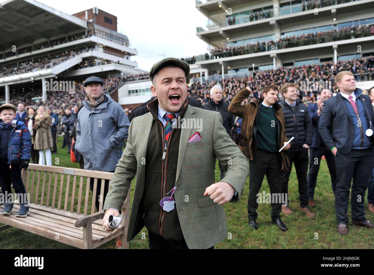 Racing at Cheltenham Racecourse, Prestbury Park on Festival Trials Day in January ahead of the Cheltenham Gold Cup Festival in March.   Crowds watchin Stock Photo