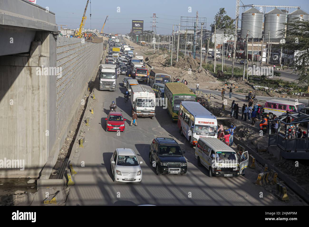 Nairobi, Kenya. 26th Jan, 2022. Traffic pilling up at a temporary bus stop at General motors area a section of the road that is almost complete of the Nairobi Expressway Project along the Mombasa road.The construction of the 27.1km long toll highway, the Nairobi Expressway continues and scheduled to be completed in June 2022. The Nairobi Expressway is meant to decongest the Nairobi city by providing faster and reliable transport. (Credit Image: © Boniface Muthoni/SOPA Images via ZUMA Press Wire) Stock Photo