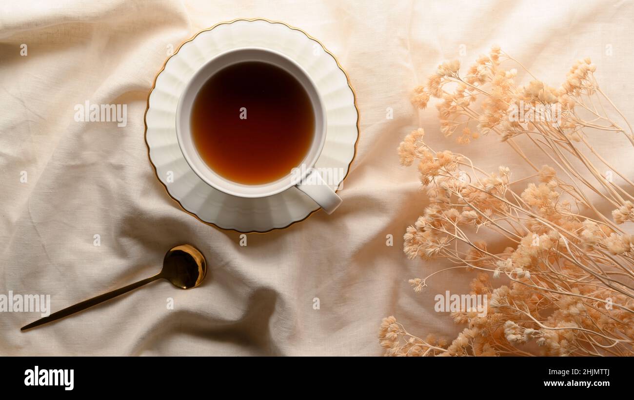 Afternoon Tea Concept A Tea Cup With Dried Flowers On Minimal White Tablecloth Top View Stock Photo Alamy