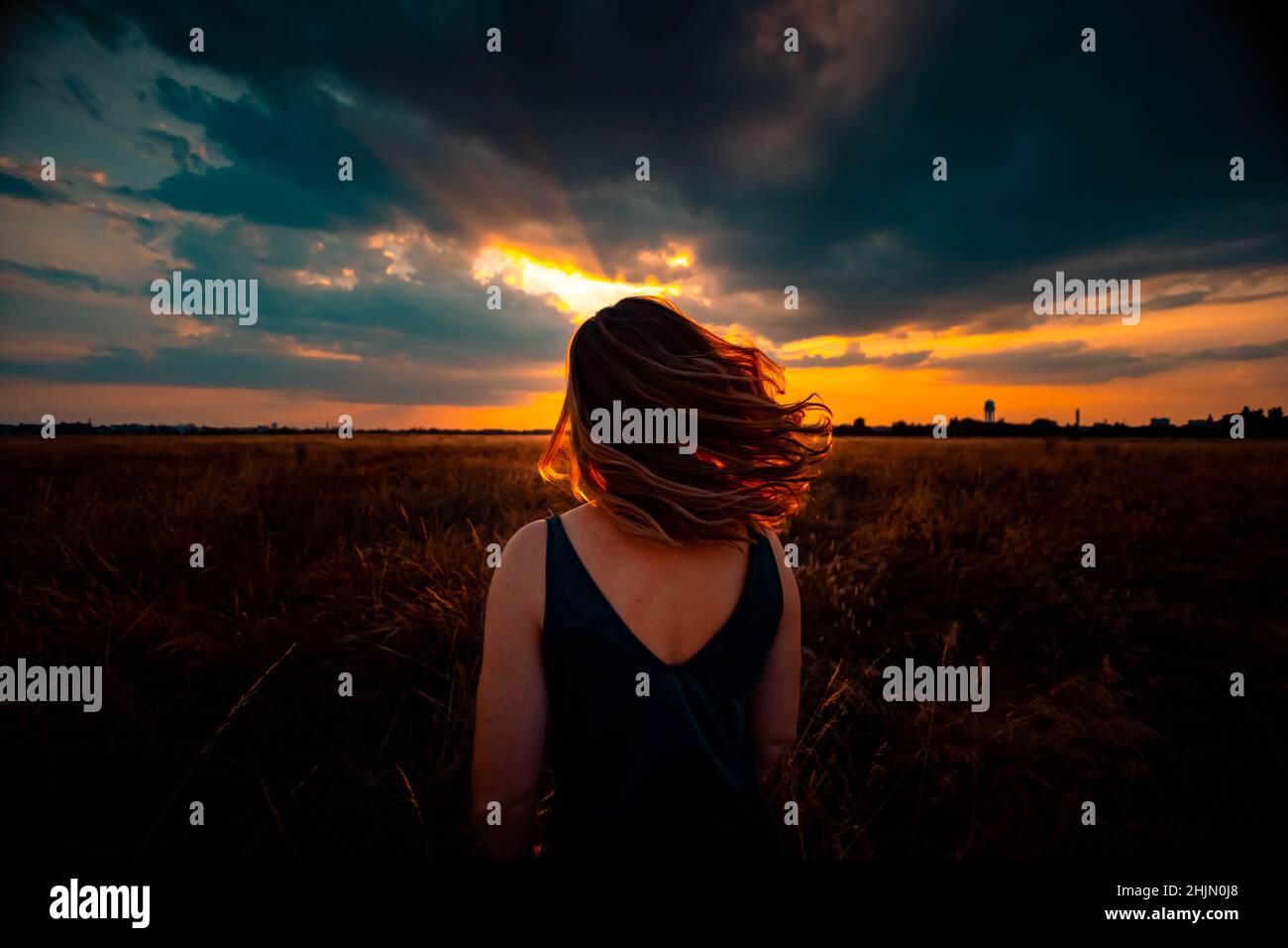 Blonde woman rear view outdoors hi-res stock photography and images - Alamy