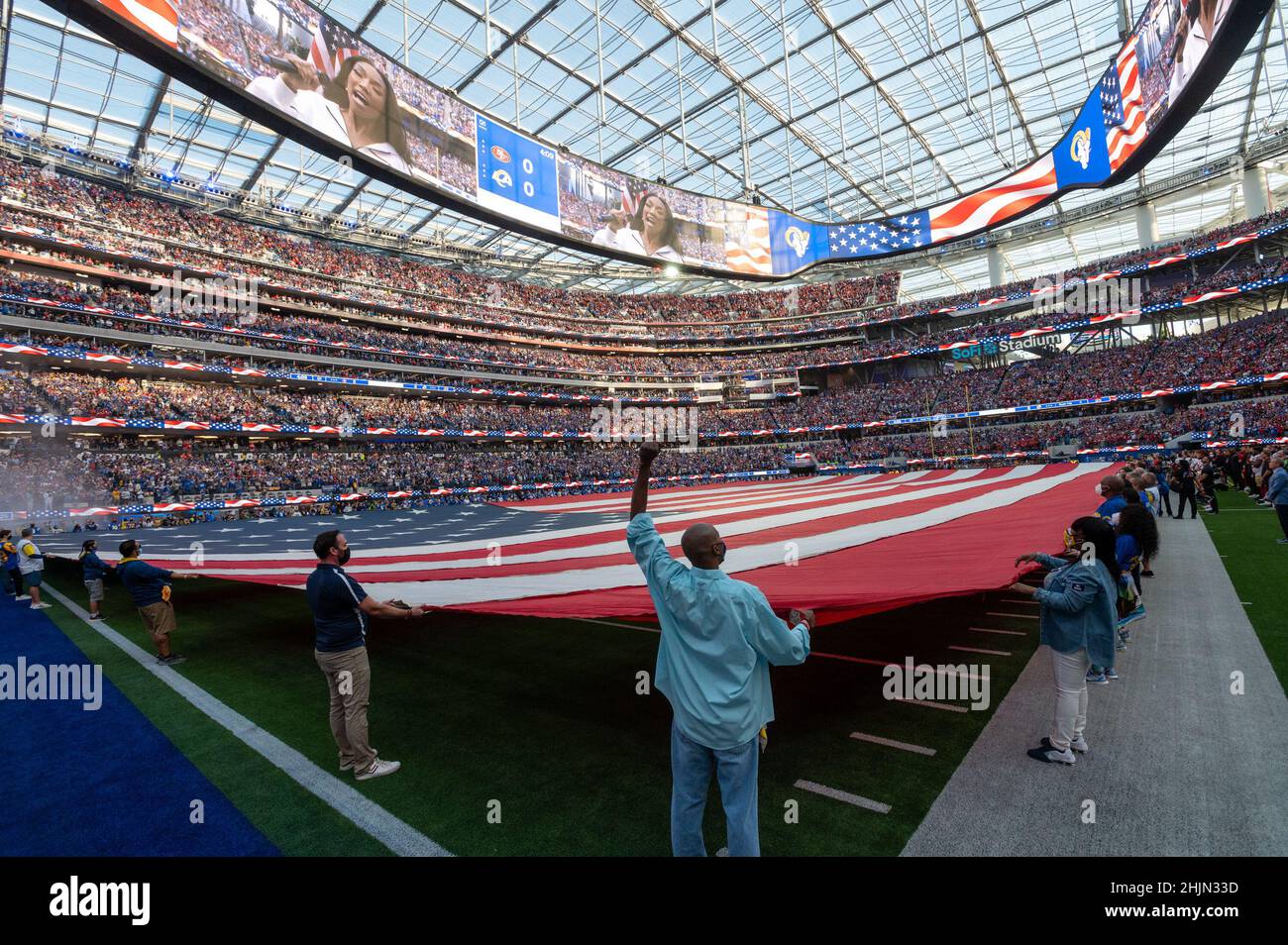 Los Angeles, CA, USA. 30th Jan, 2022. A large American flag covers the  field during pre game ceremony during the NFC Championship game at SoFi  Stadium on Sunday, Jan. 30, 2022 in