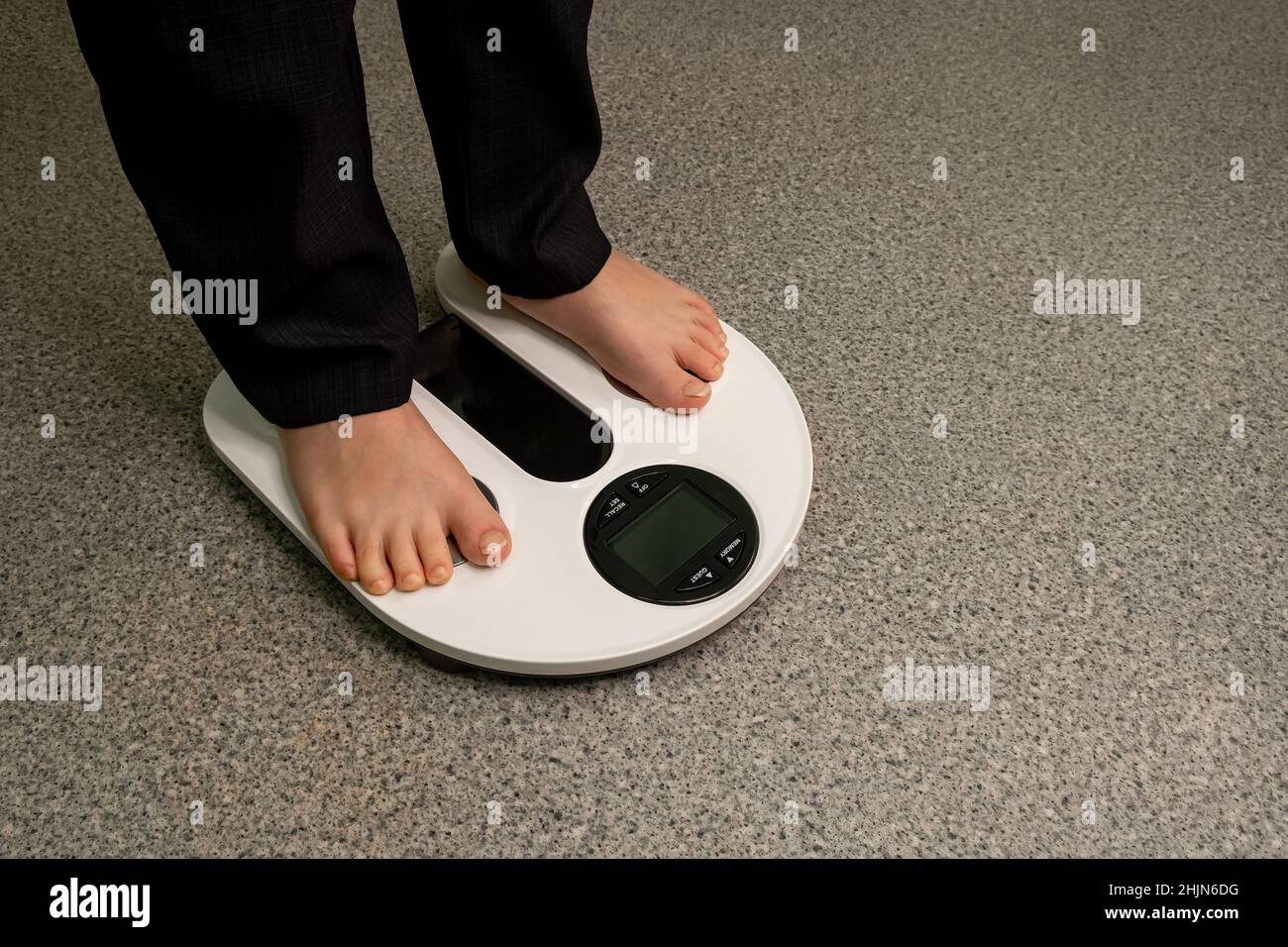 Health care, fitness and weight loss. Child on analytical balance. Stock Photo
