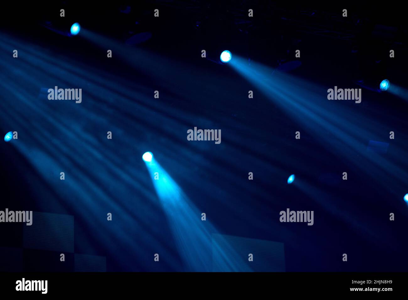 Stage lights glowing in the dark. Live music festival concept background Stock Photo