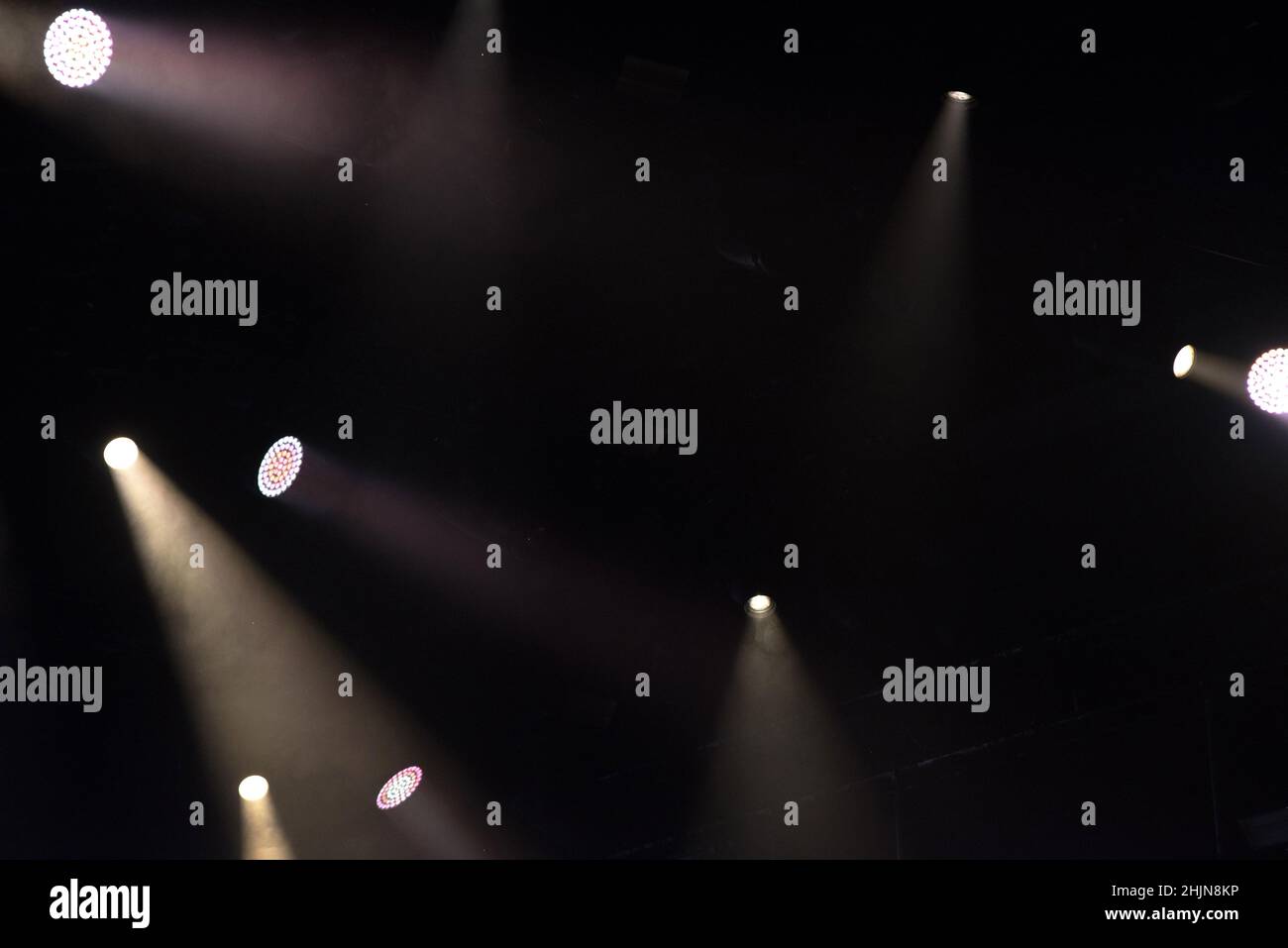 Stage lights glowing in the dark. Live music festival concept background Stock Photo