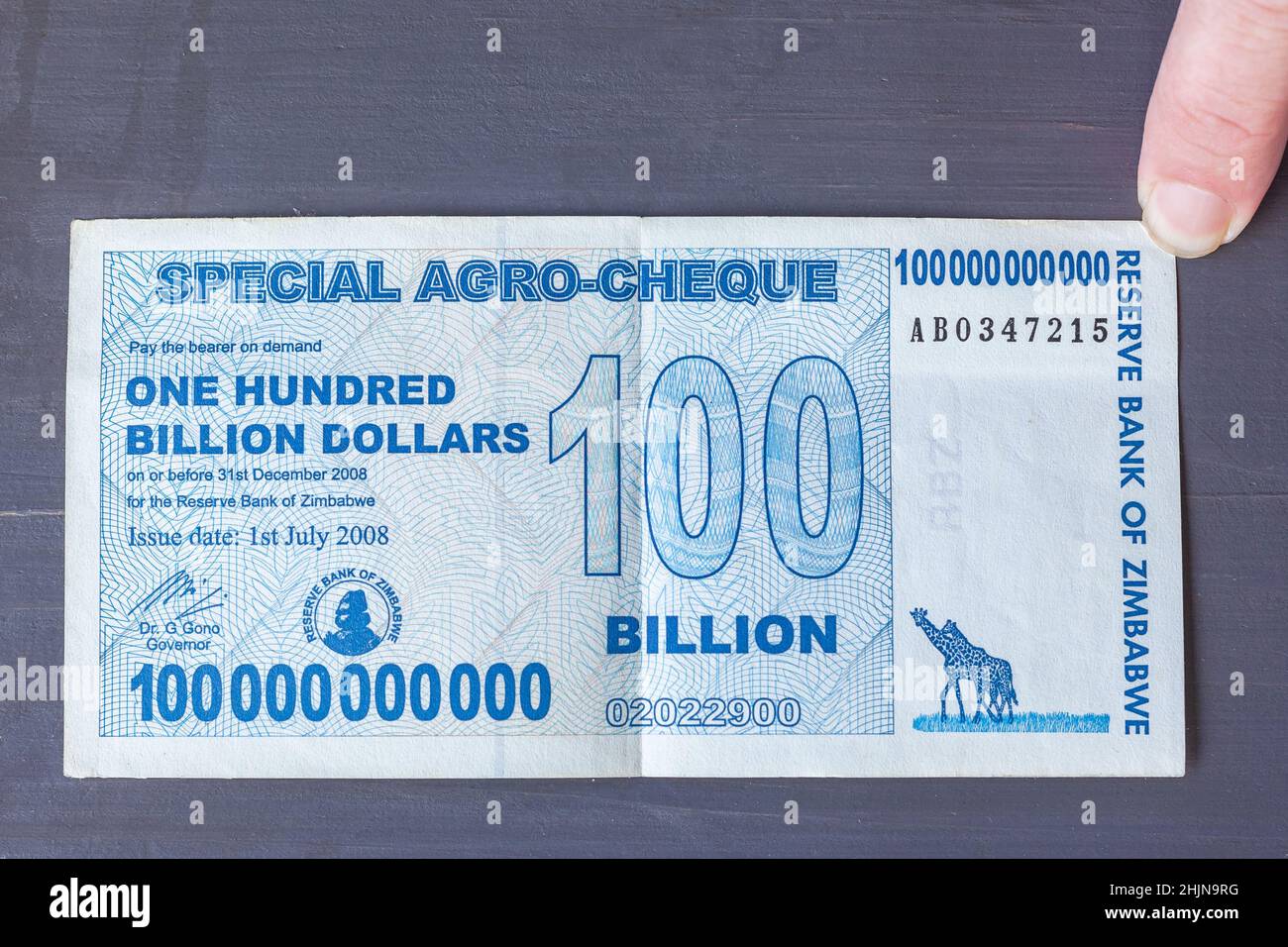Zimbabwe currency money paper note of one hundred billion dollars close up photo of 2008 failed financial economic management for global record Stock Photo