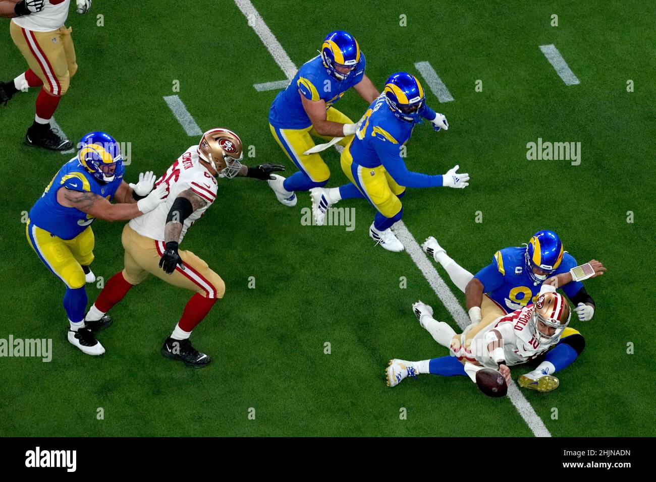 Inglewood, United States. 31st Jan, 2022. San Francisco 49ers quarter Jimmy Garoppolo (10) throws a fourth quarter interception while in the arms of Los Angeles Rams Aaron Donald during the NFC Championship game at SoFi Stadium in Inglewood, California on Sunday, January 30, 2022. The Rams defeated the Niners 20-17. Photo by Jon SooHoo/UPI Credit: UPI/Alamy Live News Stock Photo