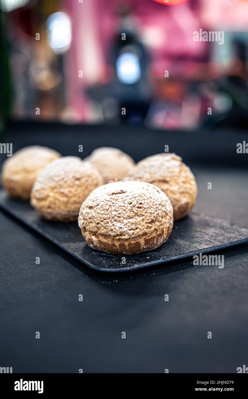 Appetizing Shu cakes on a blurred background. Stock Photo