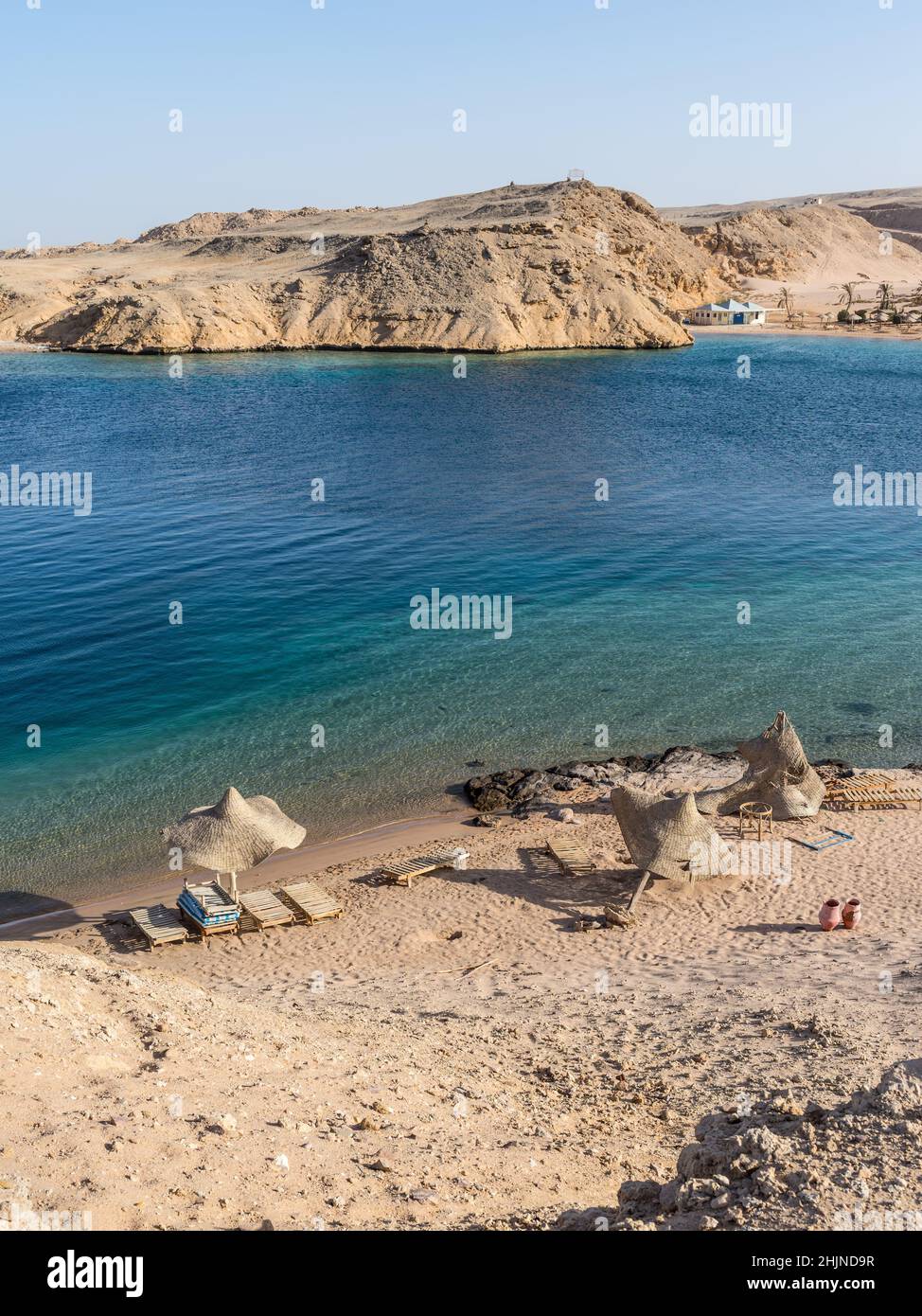 Hurghada, Egypt - June 03, 2021: Abandoned hotel the Al Nabila Grand Bay Makadi and empty beach with no people during a pandemic at the Secret bay, Hu Stock Photo