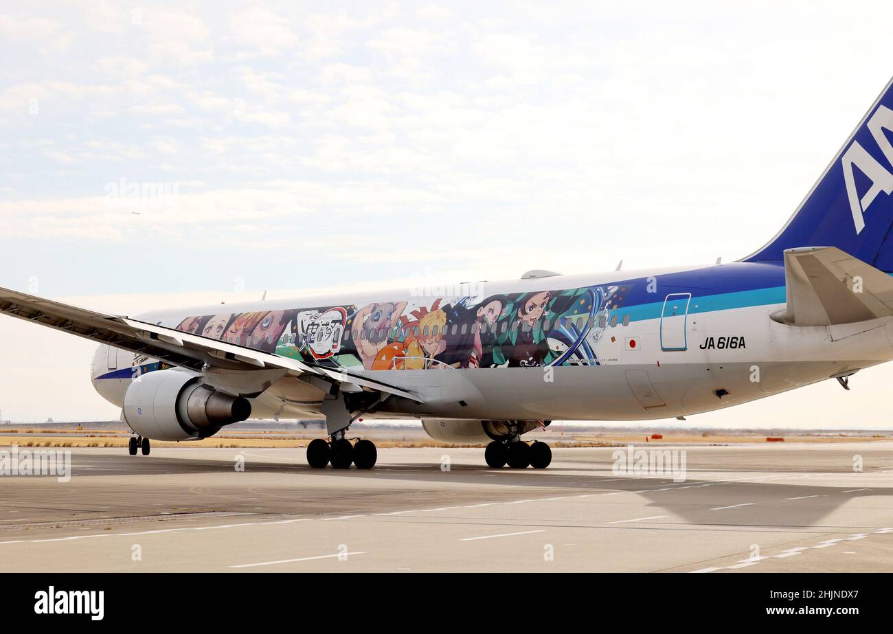 Tokyo, Japan. 30th Jan, 2022. Japanese largest air carrier All Nippon Airways' (ANA) B-767 jet designed with characters of mega hit comics and animation series 'Demon Slayer' leaves Tokyo's Haneda airport for a chartered flight on Sunday, January 30, 2022. ANA will start commercial flights of 'Demon Slayer' jet on domestic routes from January 31. Credit: Yoshio Tsunoda/AFLO/Alamy Live News Stock Photo