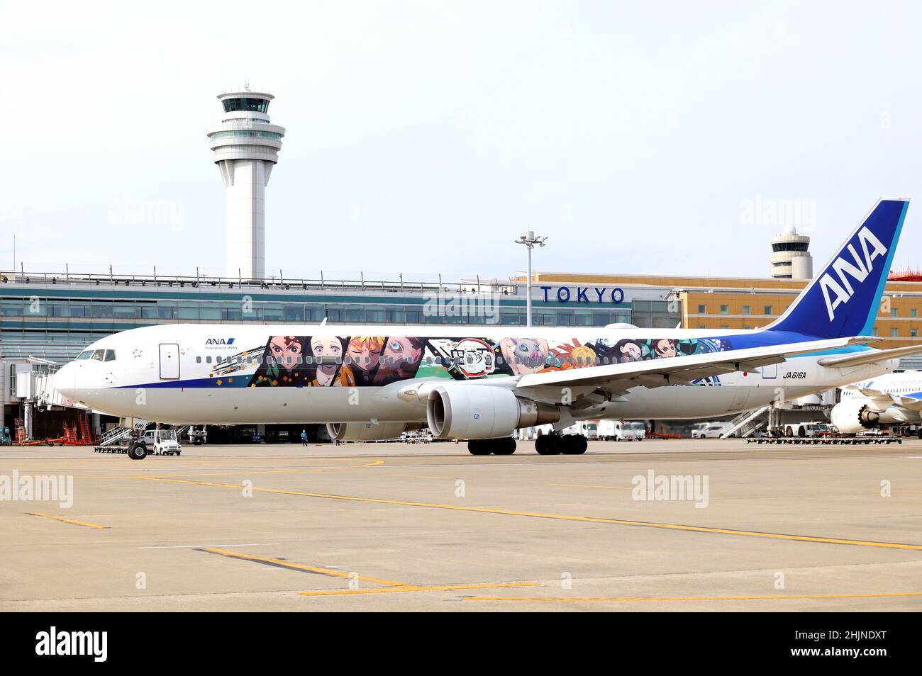 Tokyo, Japan. 30th Jan, 2022. Japanese largest air carrier All Nippon Airways' (ANA) B-767 jet designed with characters of mega hit comics and animation series 'Demon Slayer' leaves Tokyo's Haneda airport for a chartered flight on Sunday, January 30, 2022. ANA will start commercial flights of 'Demon Slayer' jet on domestic routes from January 31. Credit: Yoshio Tsunoda/AFLO/Alamy Live News Stock Photo