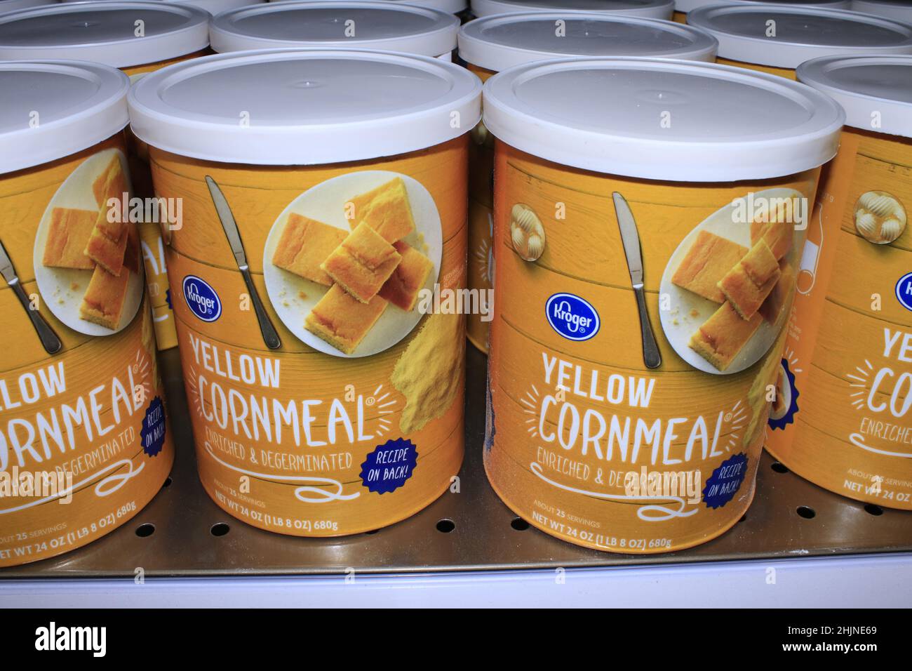 A closeup of Kroger Yellow Corn Meal in Packages on a metal shelf in a