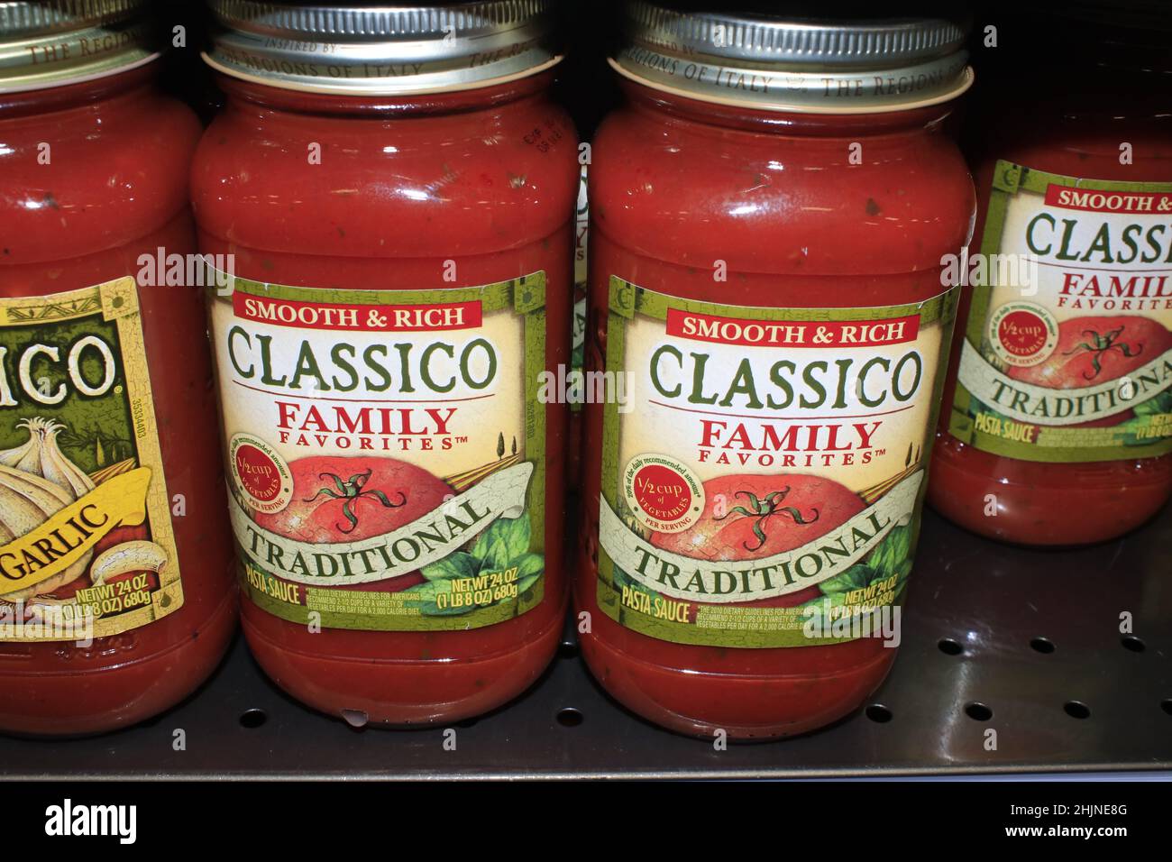 A closeup of CLASSICO Spaghetti Sauce on a metal shelf at a Dillons store in Kansas Stock Photo