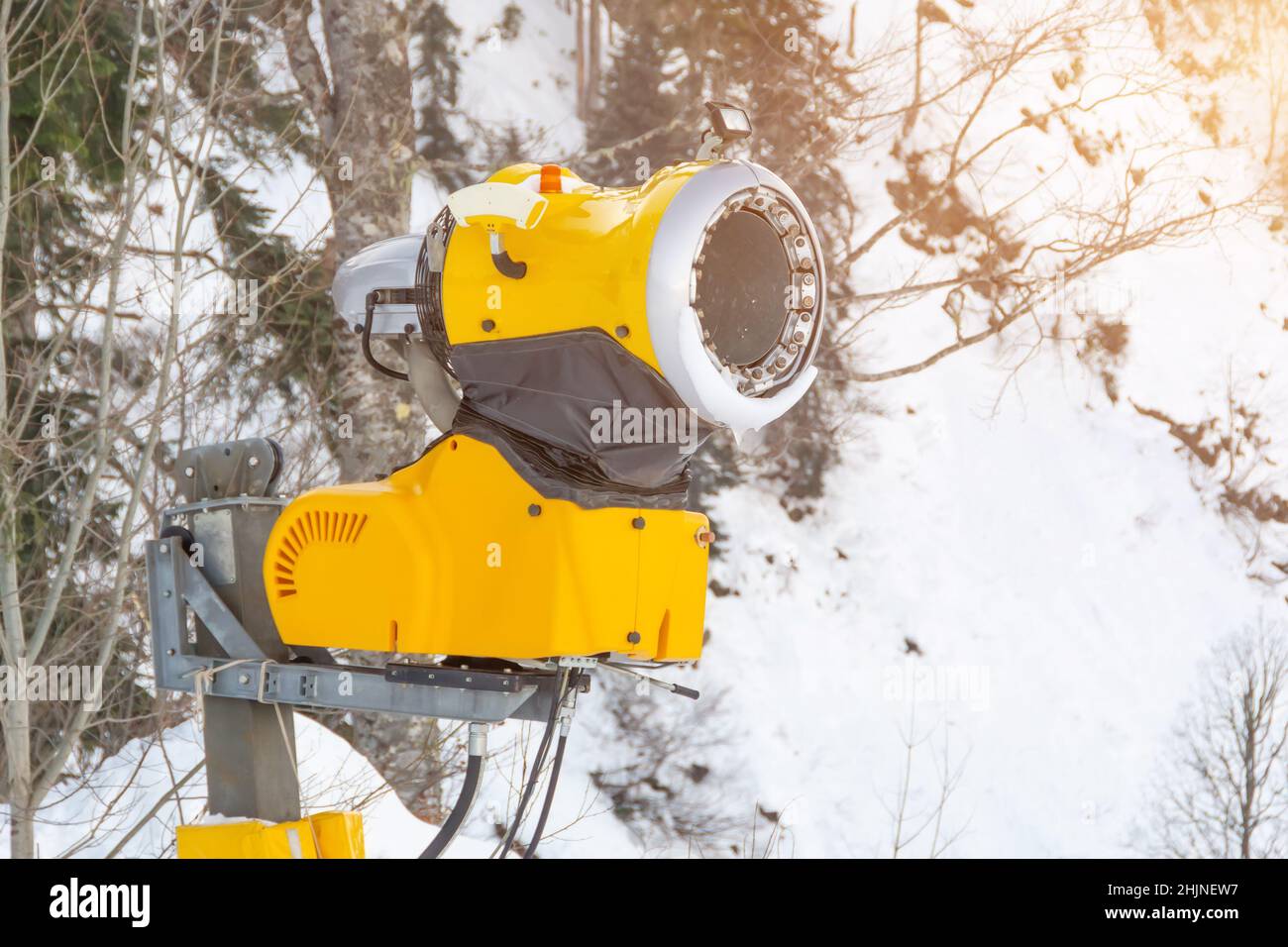 Yellow snow cannon on the slope of the ski slope Stock Photo Alamy
