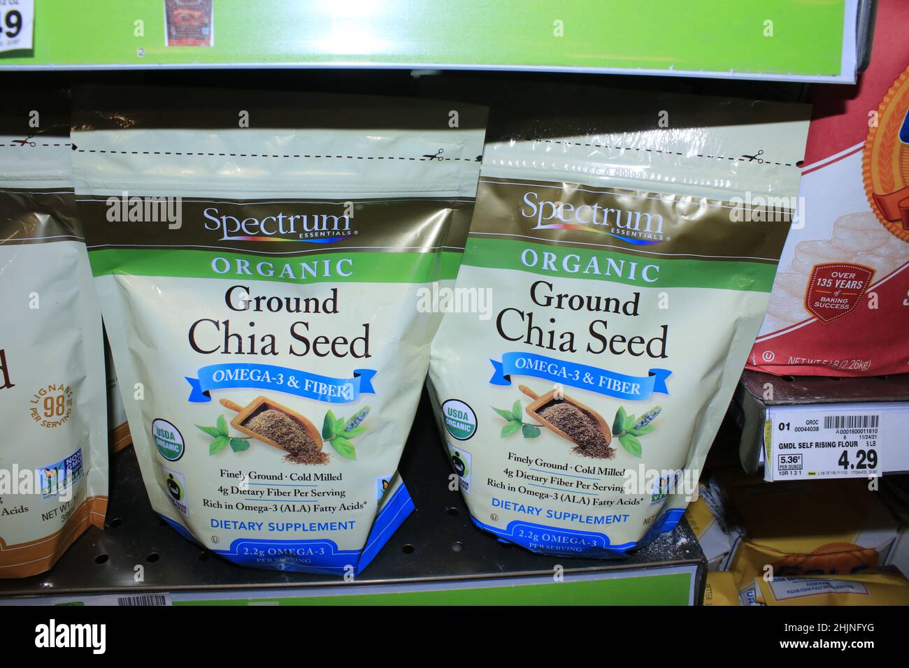 A closeup of Organic Ground Chia Seed in bags on a metal shelf at a Dillons grocery store Stock Photo