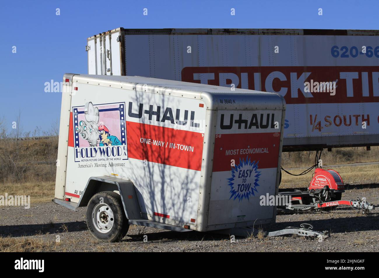 A closeup shot of a U-HAUL trailer with a blue sky in the winter time in Kansas that's bright and colorful. Stock Photo