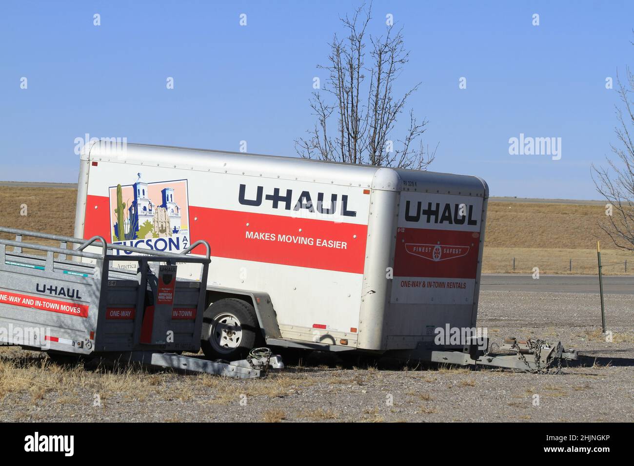 A closeup shot of a U-HAUL trailer with a blue sky in the winter time in Kansas that's bright and colorful. Stock Photo