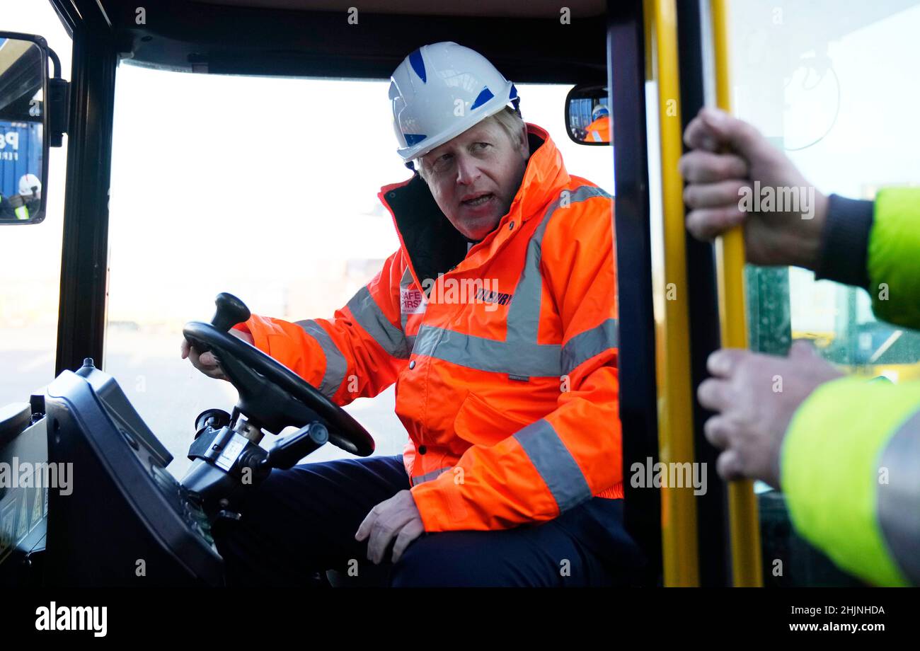 Prime Minister Boris Johnson drives a forklift as he visits the Tilbury Docks in Essex. Picture date: Monday January 31, 2022. Stock Photo