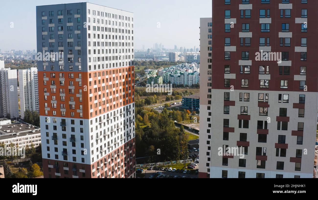 Top view of multi-colored residential complexes in city. Action ...