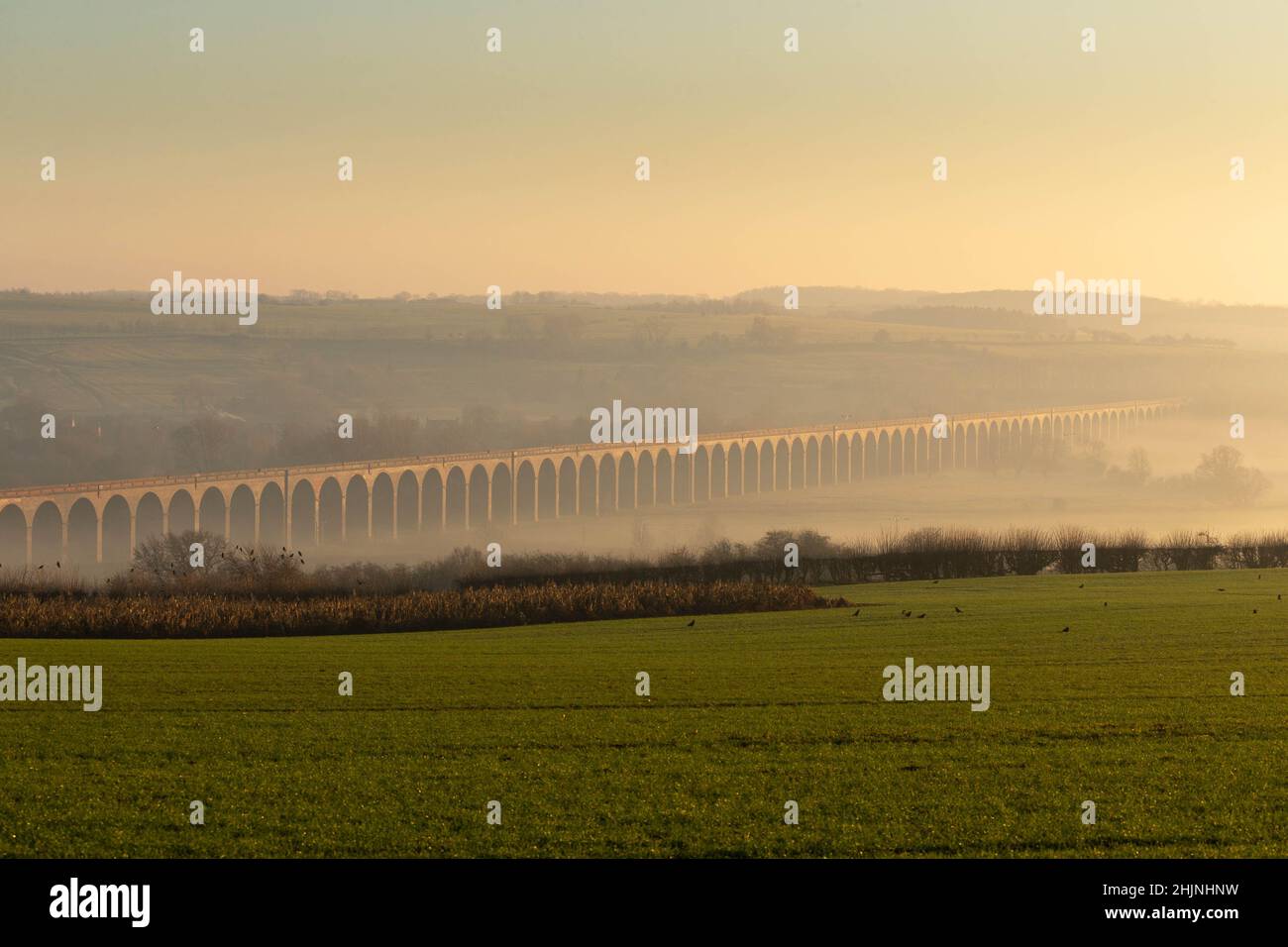 14.1.2022 Fog engulfs the Harringworth Viaduct the viaduct crosses the valley of the River Welland between Harringworth in Northamptonshire and Seaton in Rutland, England. The viaduct is 1,275 yards long and has 82 arches, each with a 40 feet span. It is the longest masonry viaduct across a valley in the United Kingdom.  ©Tim Scrivener Photographer 07850 303986      ....Covering Agriculture In The UK.... Stock Photo